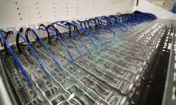Data center infrastructure submerged in a liquid cooling solution