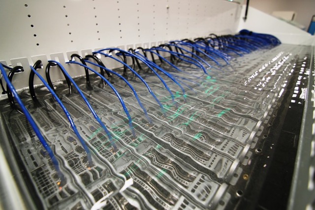 Data center infrastructure submerged in a liquid cooling solution